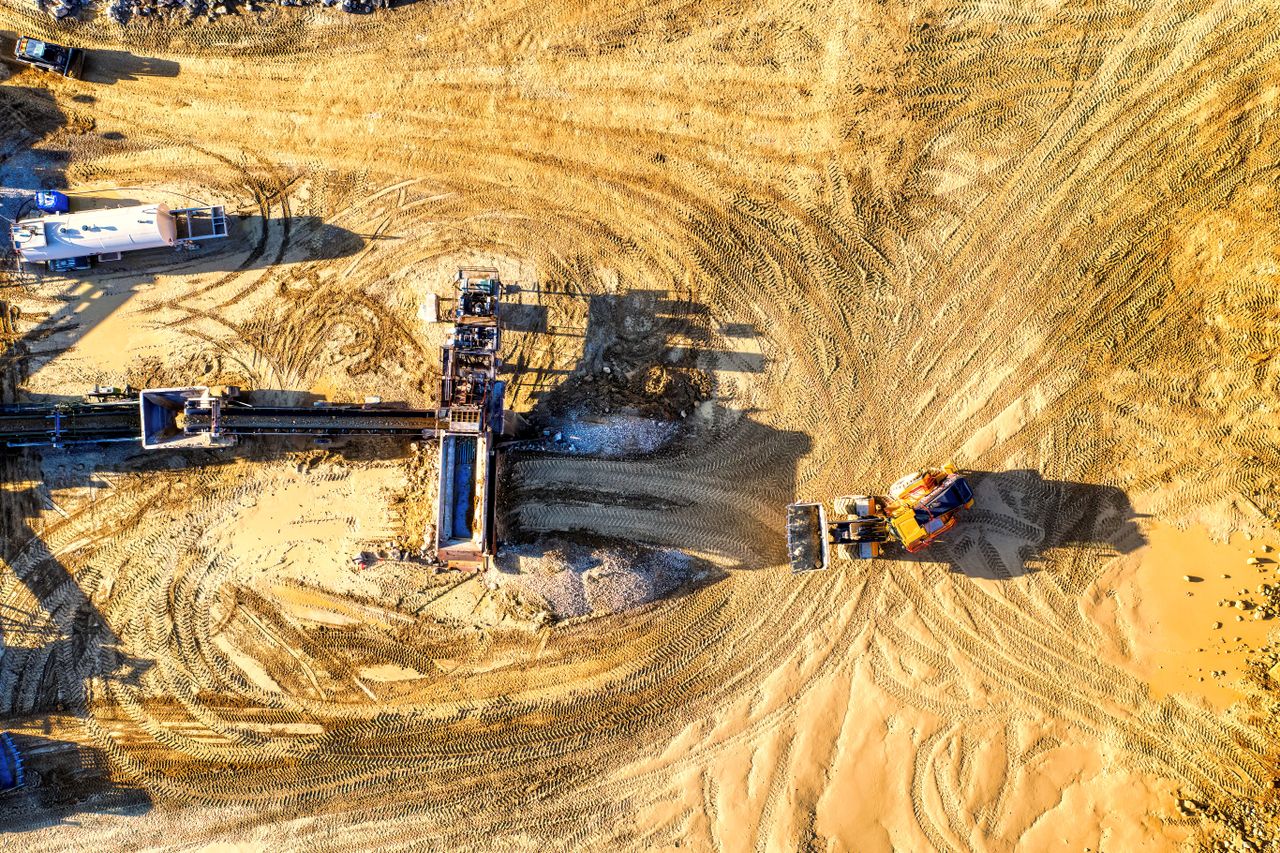 Drone shot of an industrial construction site with vehicles and machinery in Rochester, MN.