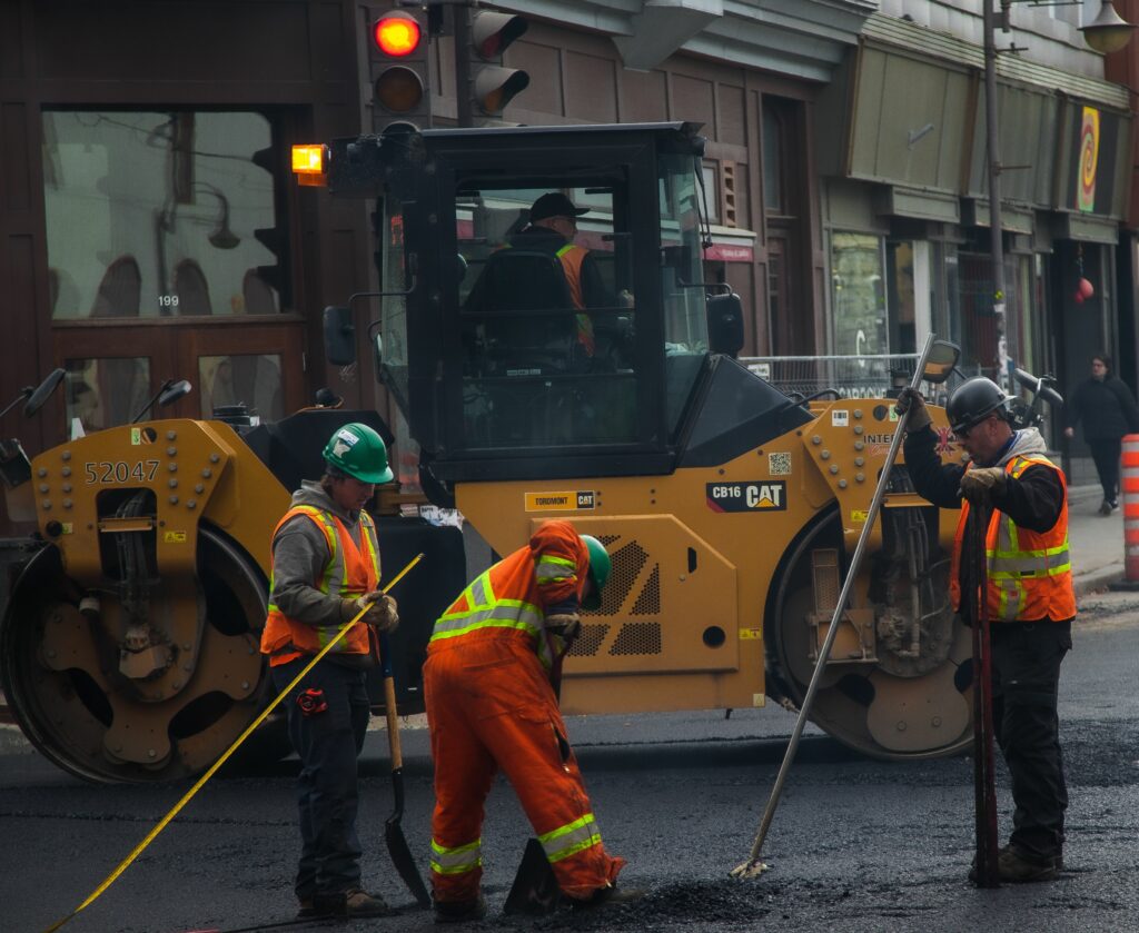 pexels photo 15437562 15437562 Workers and machinery paving a road in urban Québec City, Canada.